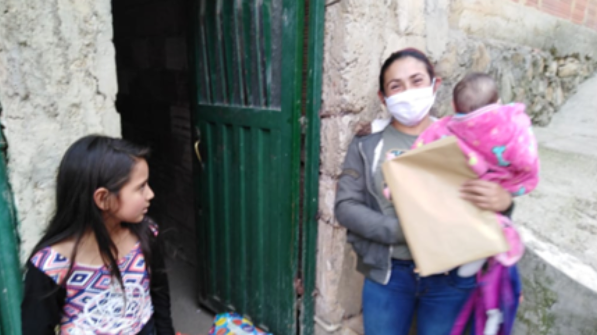 Mother Maria with her two children in Colombia