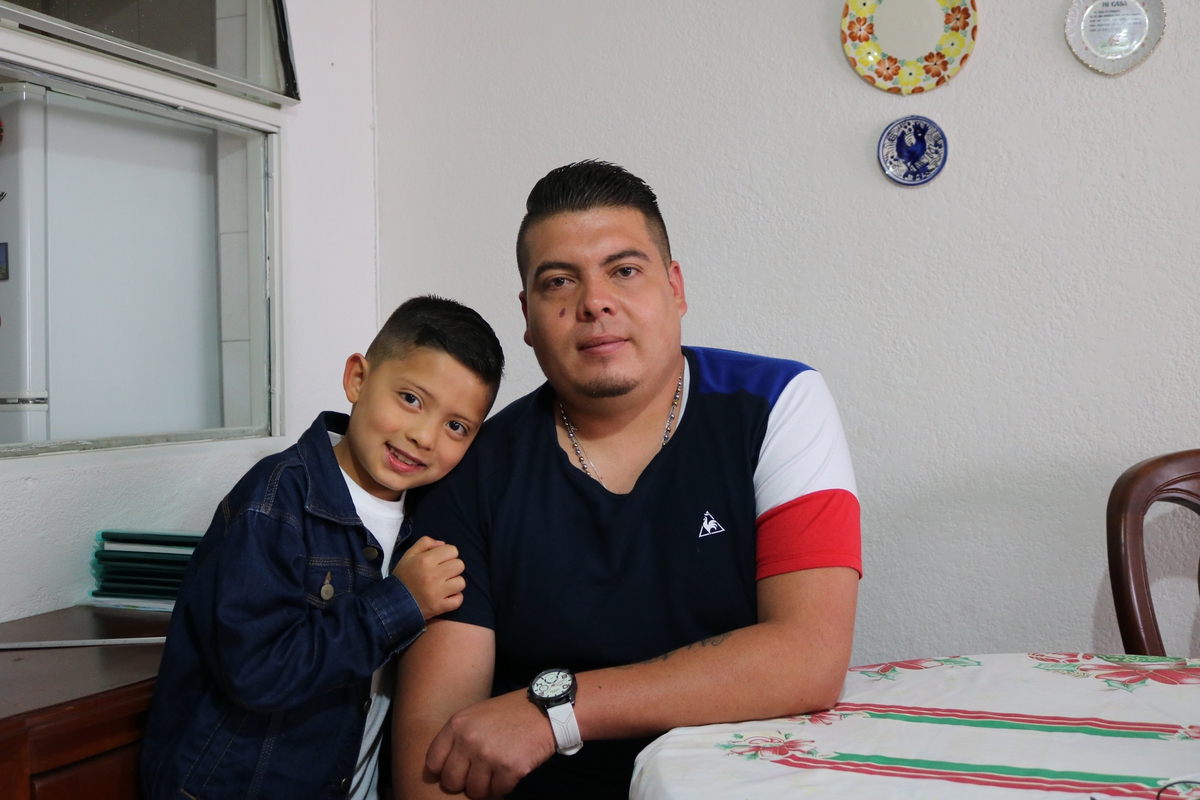 Camilo, a boy, with his father in Colombia